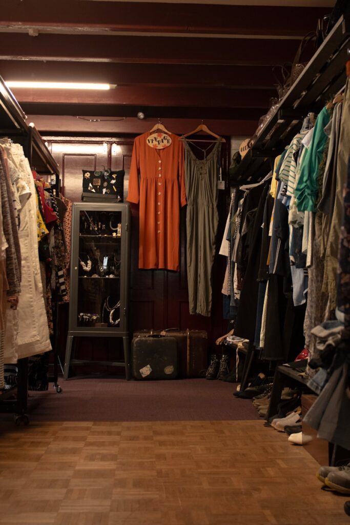a closet filled with lots of clothes and shoes